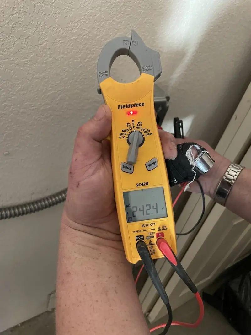 Voltage testing with clamp meter during Electrical Installation Services in Country Club Estates